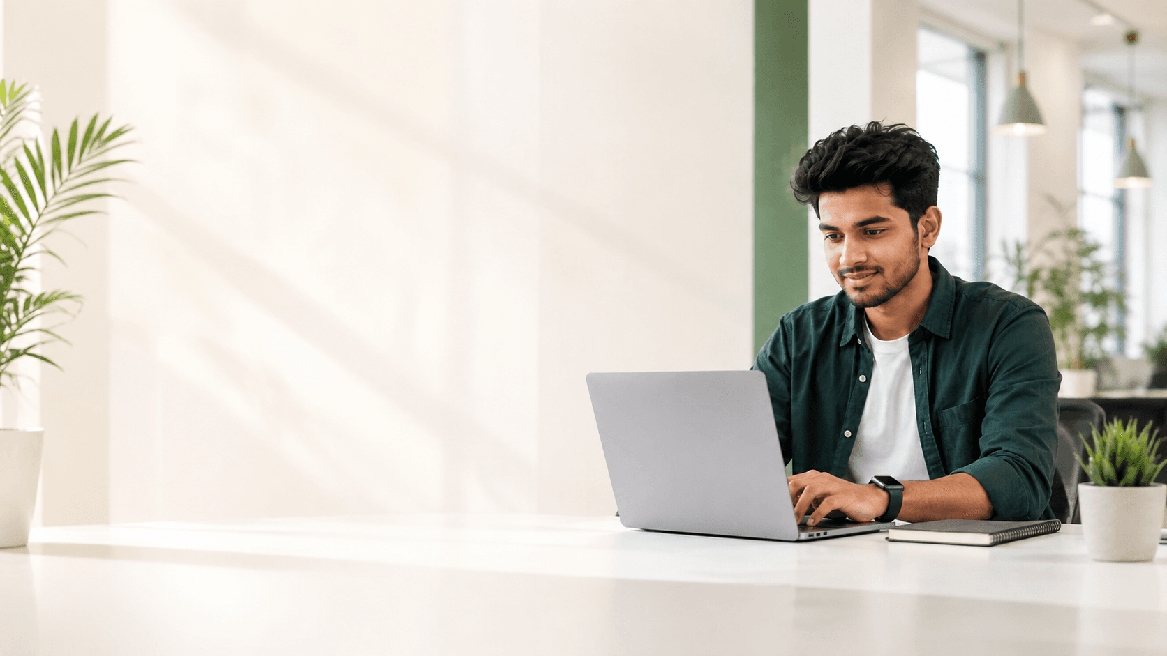 Young Indian student learning software development through practical IT training